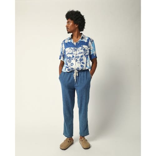 laydown image of Washed Indigo Drawstring Trousers