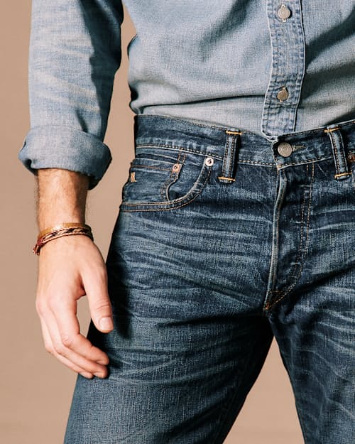 on model image of Slim Fit Selvedge Denim Jeans
