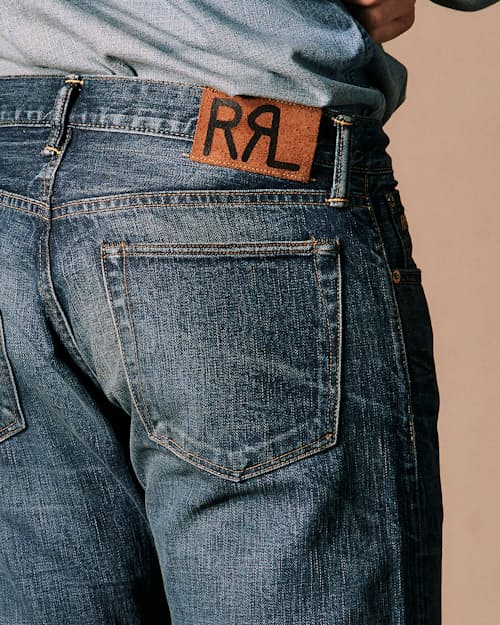 on model image of Slim Fit Selvedge Denim Jeans