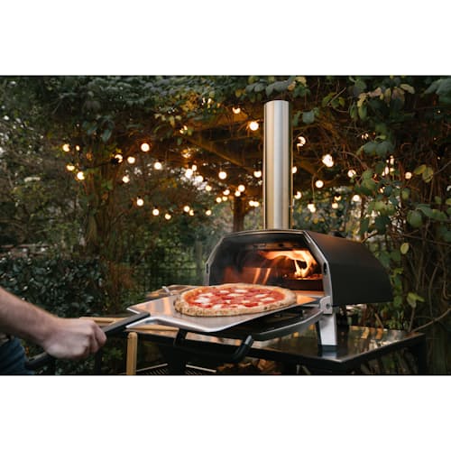 lifestyle image of Ooni Karu 16 Wood and Charcoal-Fired Portable Pizza Oven