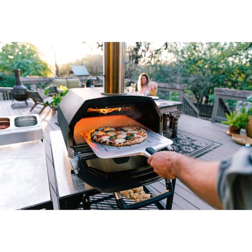 lifestyle image of Ooni Karu 16 Wood and Charcoal-Fired Portable Pizza Oven