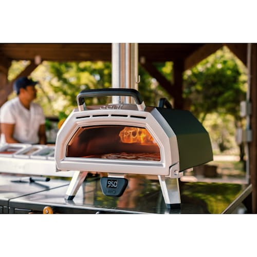 lifestyle image of Ooni Karu 16 Wood and Charcoal-Fired Portable Pizza Oven