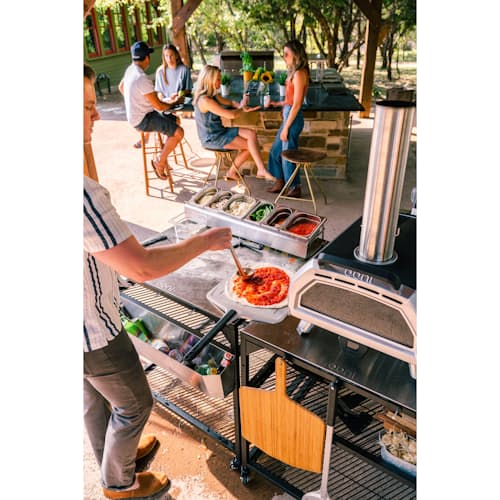 lifestyle image of Ooni Karu 16 Wood and Charcoal-Fired Portable Pizza Oven