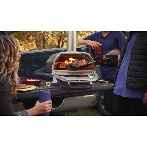 lifestyle image of Ooni Karu 16 Wood and Charcoal-Fired Portable Pizza Oven