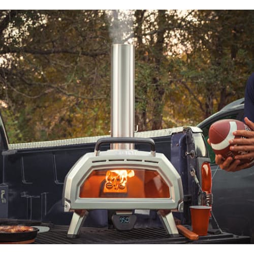 lifestyle image of Ooni Karu 16 Wood and Charcoal-Fired Portable Pizza Oven