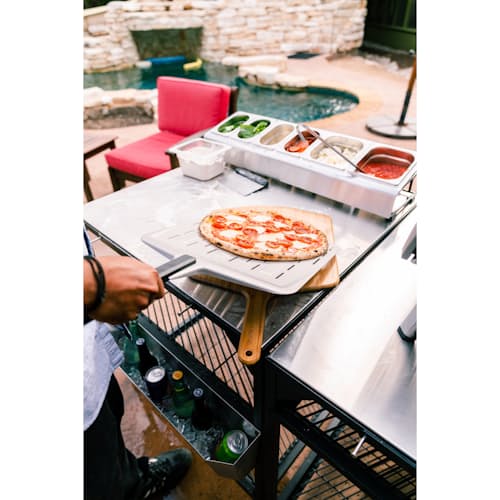 lifestyle image of 14" Perforated Pizza Peel