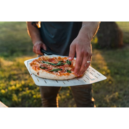 lifestyle image of 14" Perforated Pizza Peel