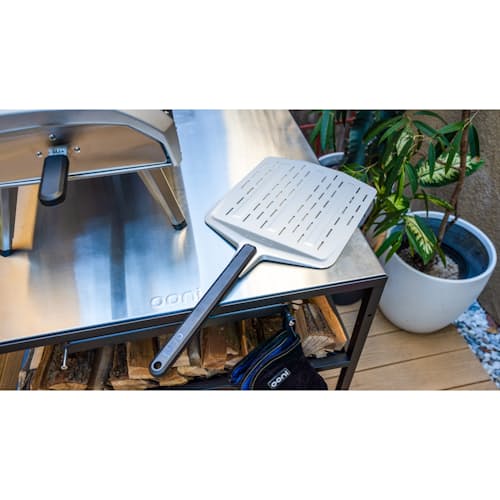 lifestyle image of 14" Perforated Pizza Peel