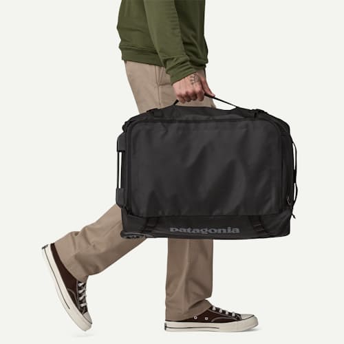 on model image of Black Hole Wheeled Duffel - 40L