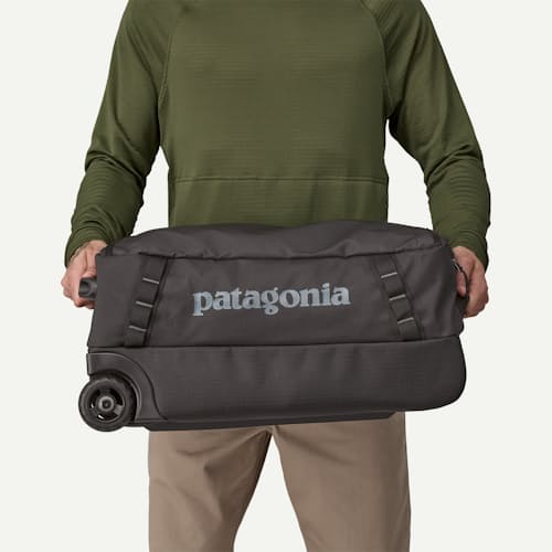 on model image of Black Hole Wheeled Duffel - 40L