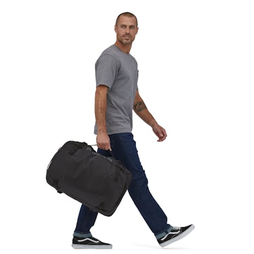 on model image of Black Hole MLC Travel Backpack - 45L
