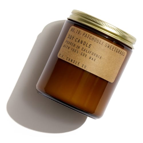 laydown image of Patchouli Sweetgrass Soy Candle