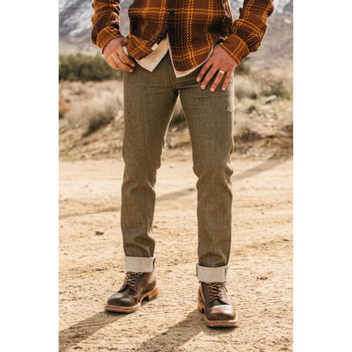 lifestyle image of The Pen Slim Stretch Selvedge Denim Jeans