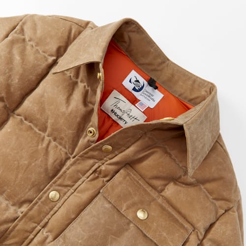 laydown image of Huckberry x Thomas Rhett Waxed Canvas Puffer Jacket