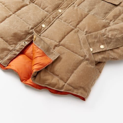 lifestyle image of Huckberry x Thomas Rhett Waxed Canvas Puffer Jacket