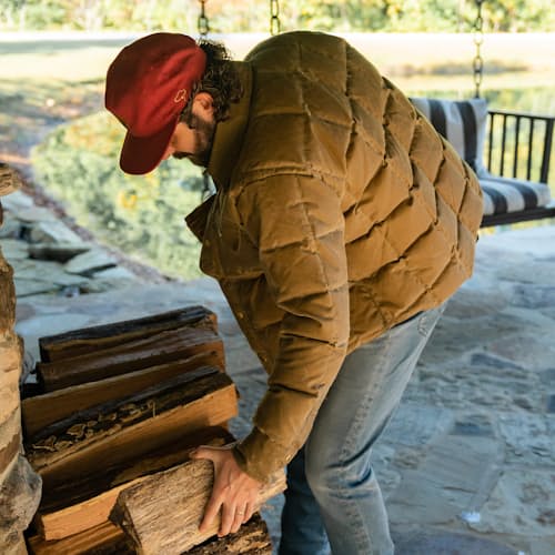 lifestyle image of Huckberry x Thomas Rhett Waxed Canvas Puffer Jacket
