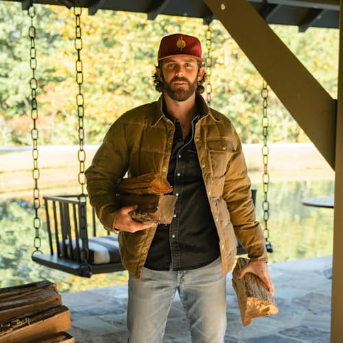 lifestyle image of Huckberry x Thomas Rhett Waxed Canvas Puffer Jacket