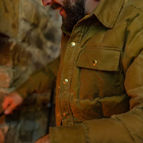 lifestyle image of Huckberry x Thomas Rhett Waxed Canvas Puffer Jacket