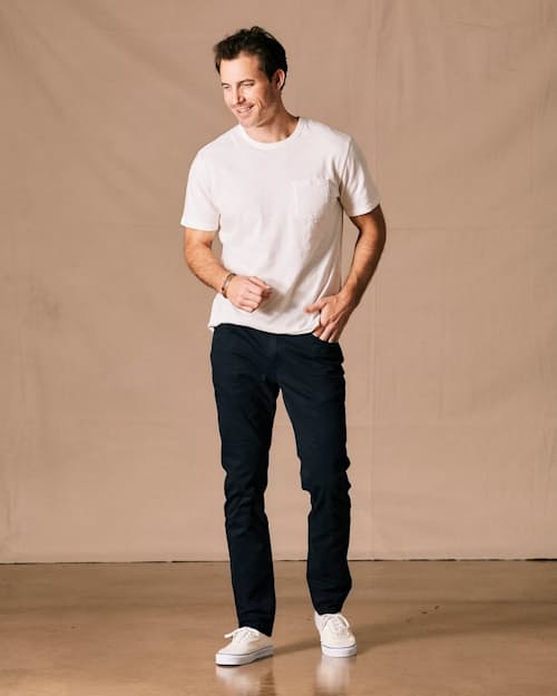 Anthony is 6'2", 187lbs, and wearing a size 32 in Dark Navy