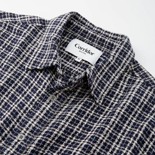 laydown image of Reverse Tweed Snow Check Long Sleeve Shirt