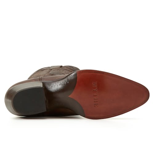 laydown image of Huckberry x Wythe Leather Western Boot