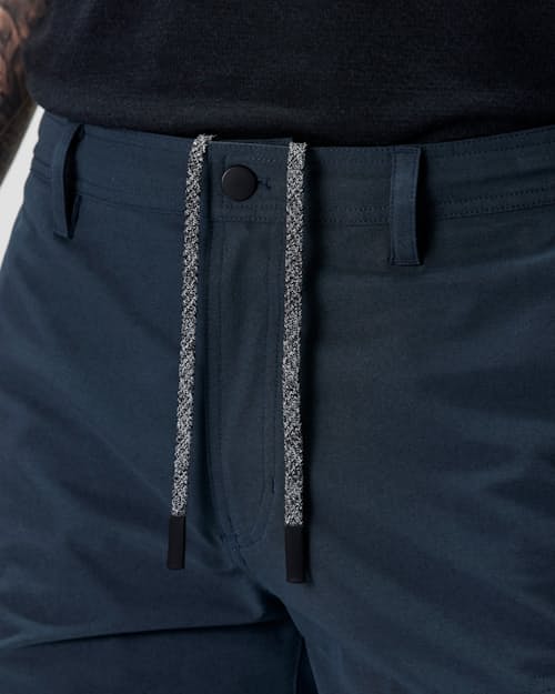 on model image of Equator Cargo Hybrid Short - 7"