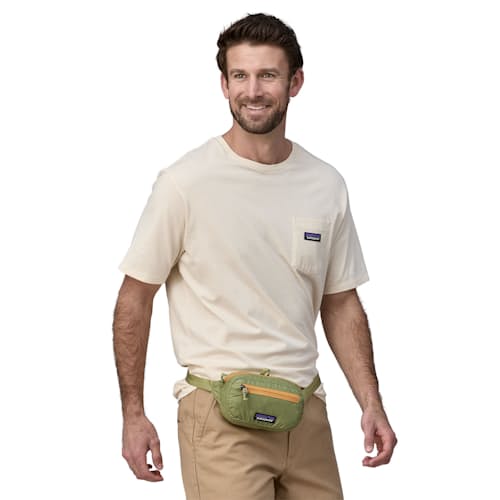 on model image of Ultralight Black Hole Mini Hip Pack - 1L