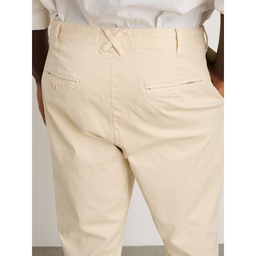 on model image of Standard Pleated Chino Pant