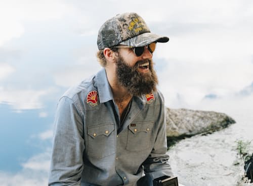 lifestyle image of Lightning Badge Foam Trucker Hat