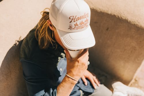 lifestyle image of Howler Posse Foam Trucker Hat