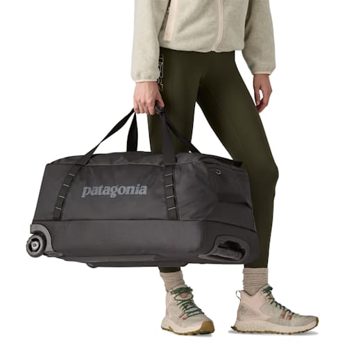 on model image of Black Hole Wheeled Duffel Bag - 70L
