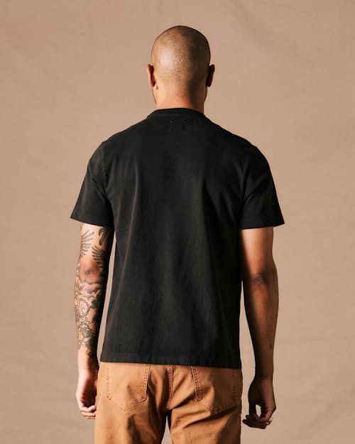 on model image of American Heavyweight Pocket T-Shirt