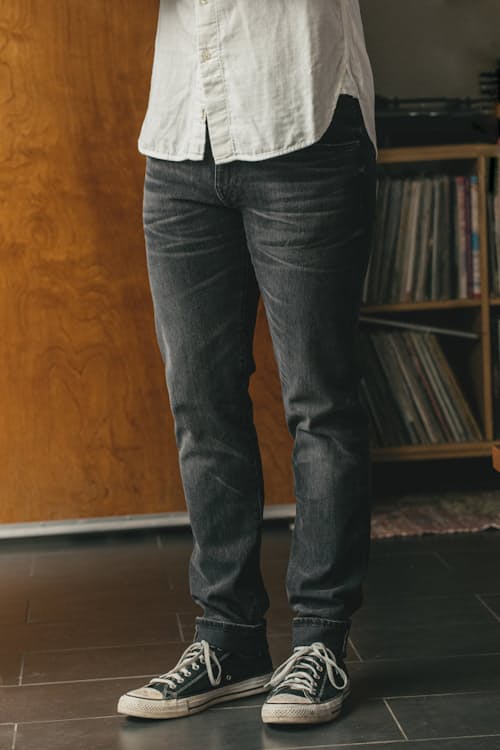 lifestyle image of The Pen Slim Straight Stretch Selvedge Denim Jeans