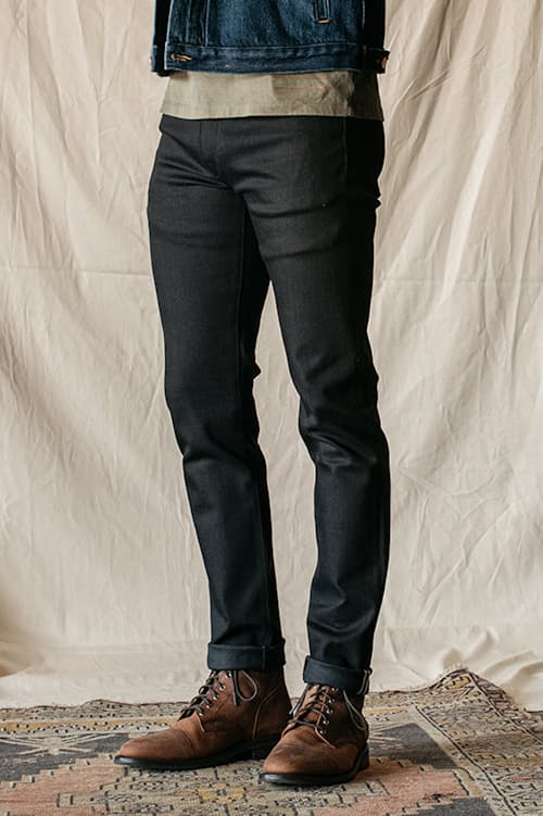 lifestyle image of The Pen Slim Straight Stretch Selvedge Denim Jeans