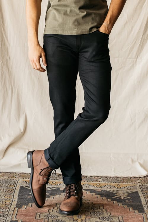 lifestyle image of The Pen Slim Straight Stretch Selvedge Denim Jeans