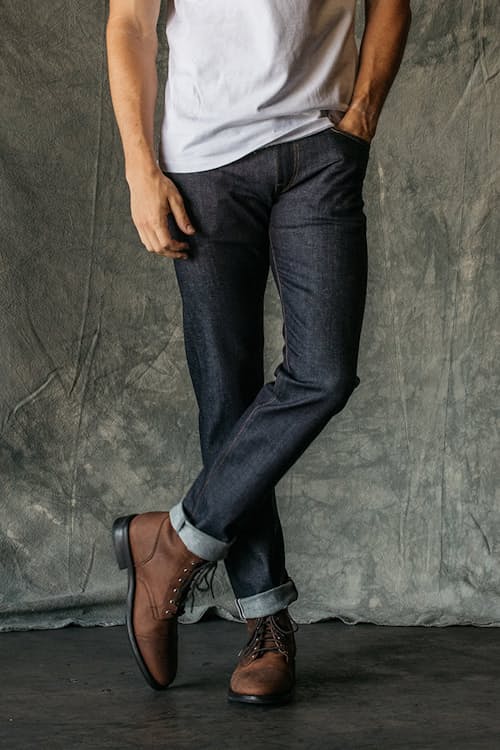 lifestyle image of The Pen Slim Straight Stretch Selvedge Denim Jeans