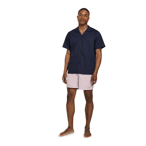 on model image of Classic Solid Swim Shorts - 5.5"