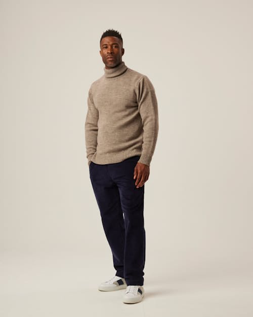 on model image of Merino Wool Turtleneck