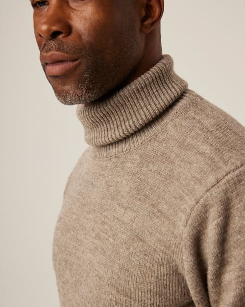 on model image of Merino Wool Turtleneck