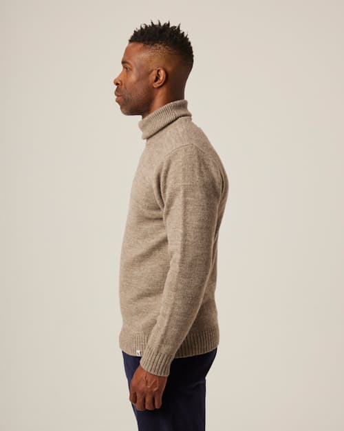 on model image of Merino Wool Turtleneck