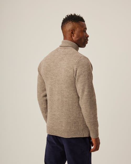 on model image of Merino Wool Turtleneck