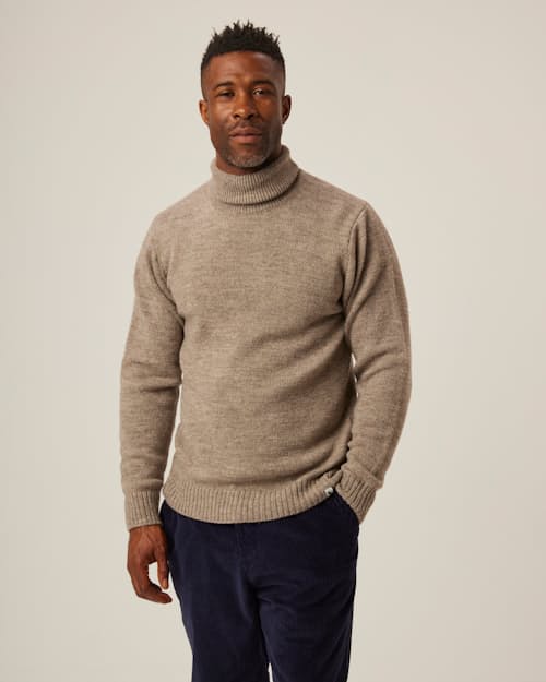 on model image of Merino Wool Turtleneck
