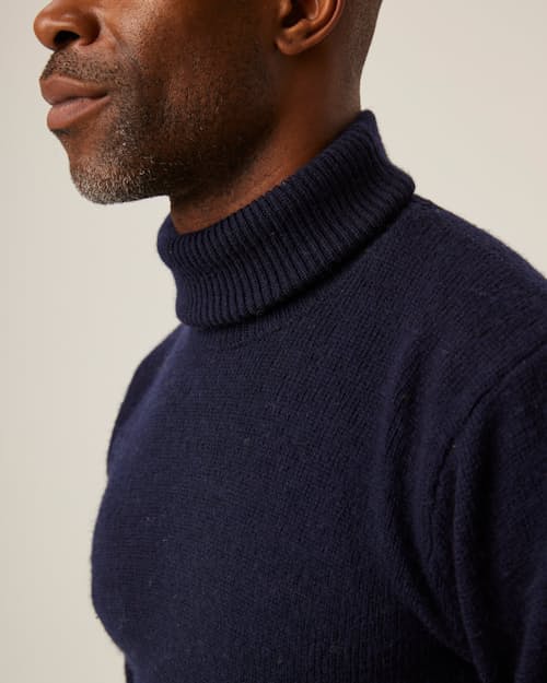 on model image of Merino Wool Turtleneck