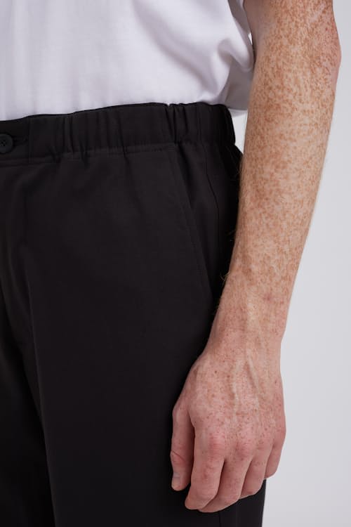 on model image of Ezra Relaxed Solotex DWR Trouser