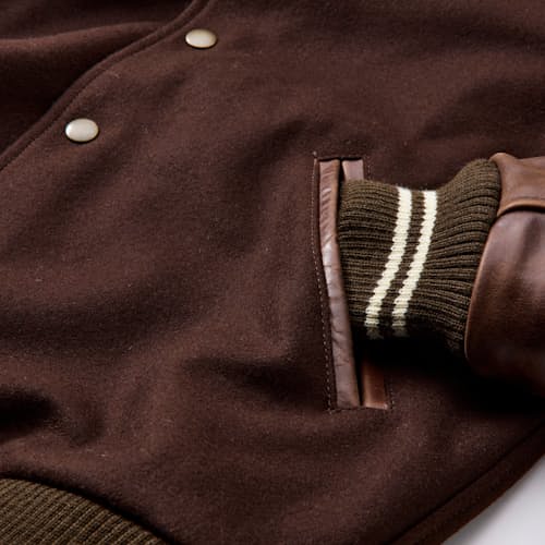 laydown detail image of Leather and Wool-Blend Varsity Bomber Jacket