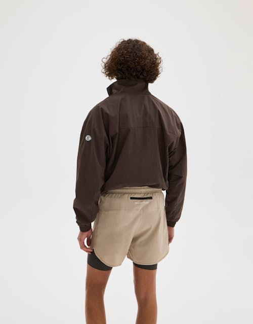 on model image of Layered Pocketed Trail Shorts - 5"