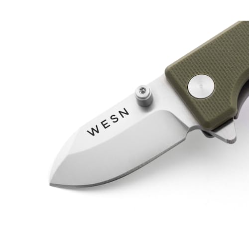 laydown detail image of The Microblade Keychain Pocket Knife