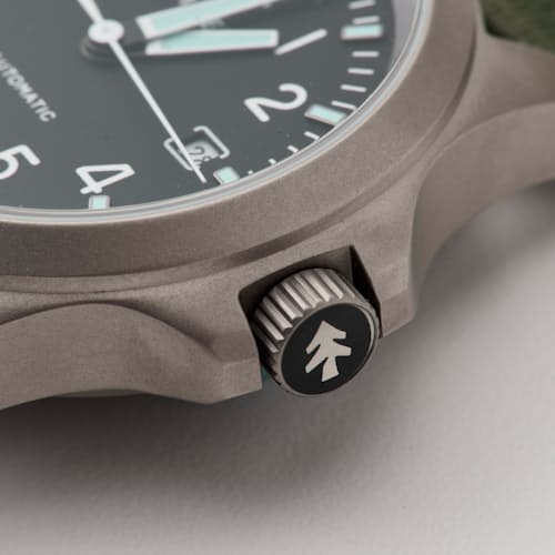 laydown detail image of Huckberry x Timex Titanium Automatic Field Watch