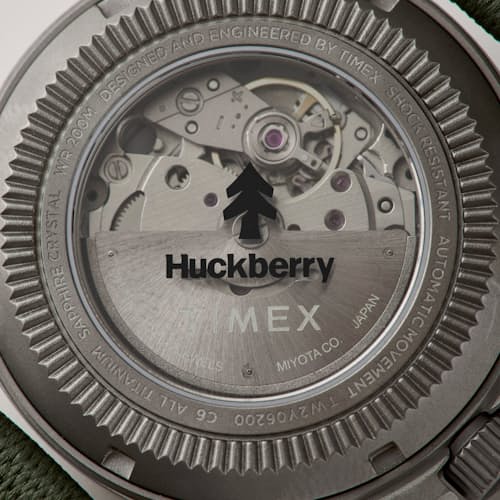 laydown detail image of Huckberry x Timex Titanium Automatic Field Watch