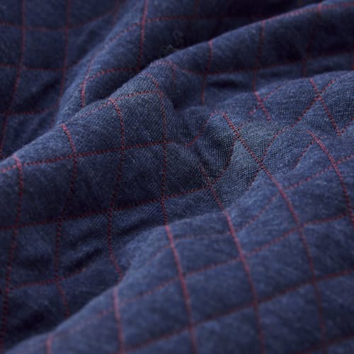 laydown detail image of Corbet Quilted Reversible Pullover